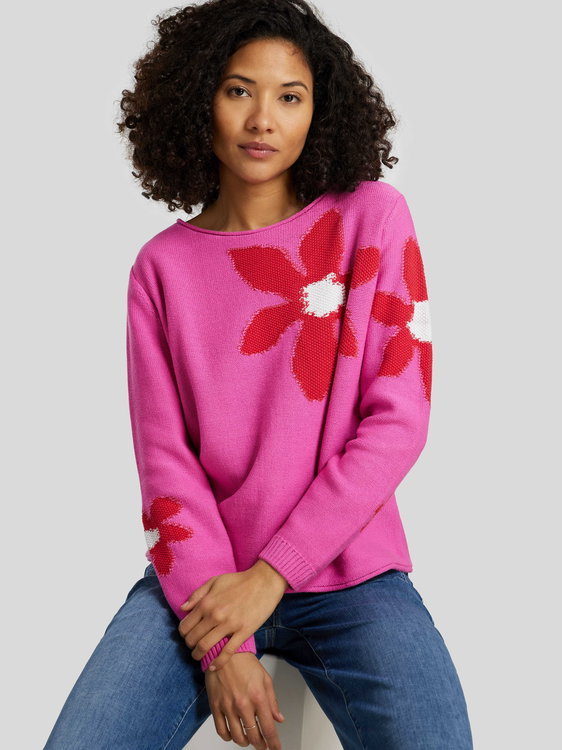Bild von Strickpullover mit Blumen-Motiv
