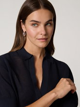 Bild von Poloshirt aus Lochstrick DYLAI